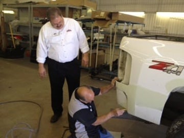 John Elway Dealerships mechanics in body shop